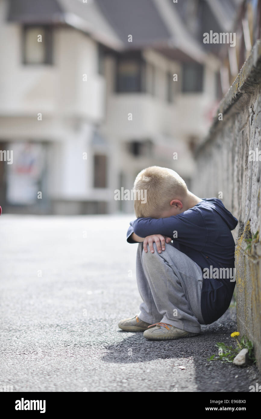 sad lonely boy on street Stock Photo - Alamy