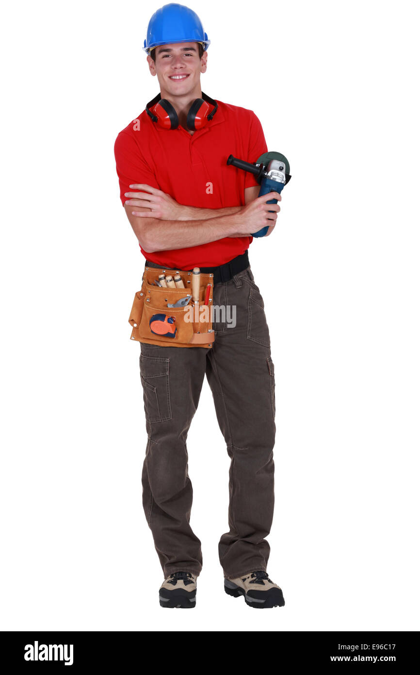 Worker holding angle grinder Stock Photo
