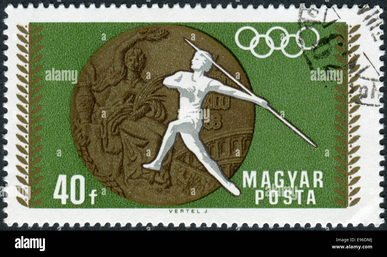 Stamp printed in Hungary, devoted to 19th Summer Olympics, Mexico City in 1968, shows the Olympic Medal and Women's Javelin Stock Photo