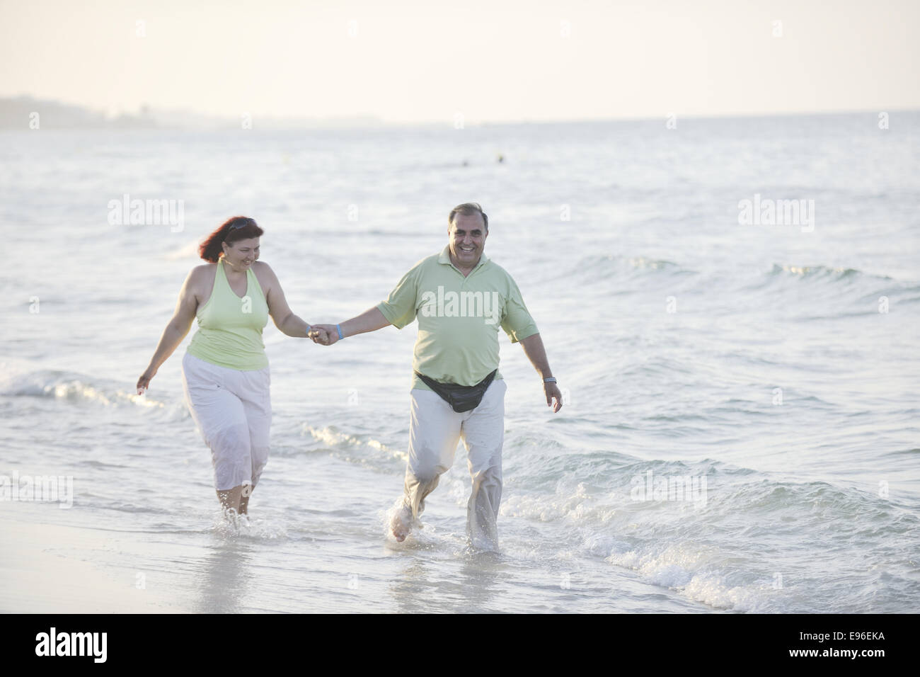 happy seniors couple on beach Stock Photo - Alamy