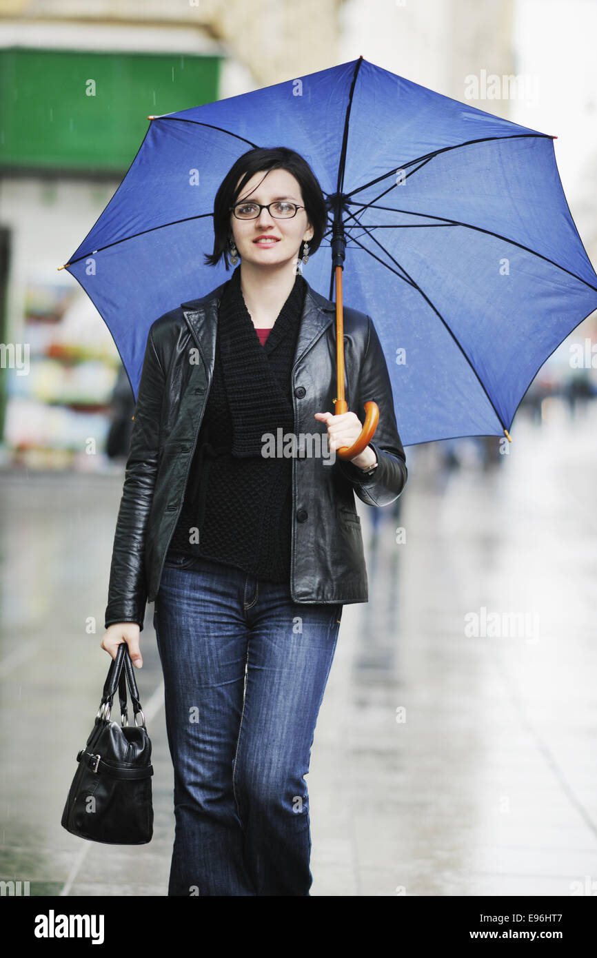 woman on street with umbrella Stock Photo - Alamy