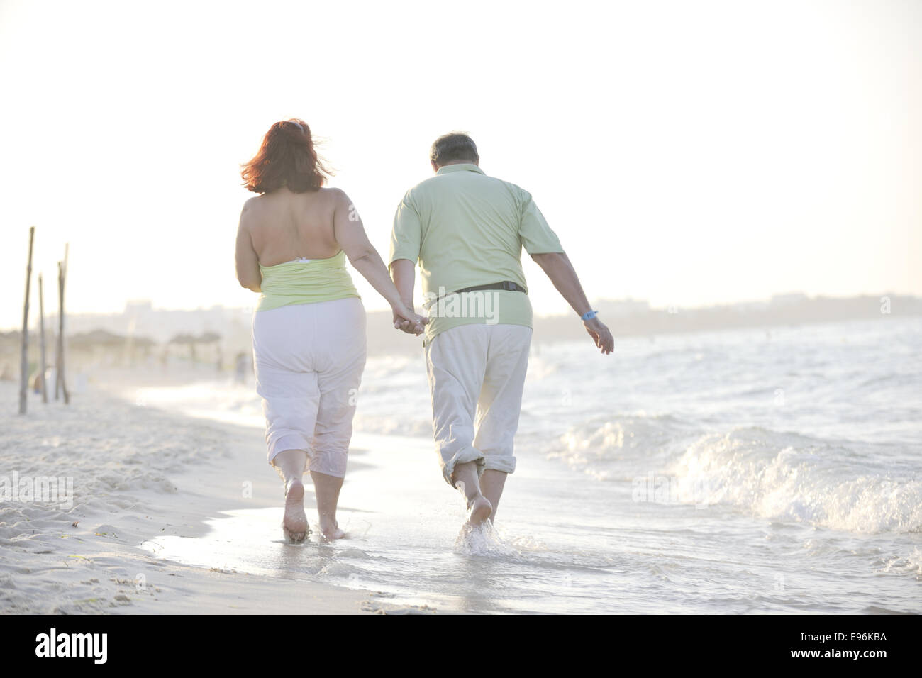 happy seniors couple on beach Stock Photo - Alamy
