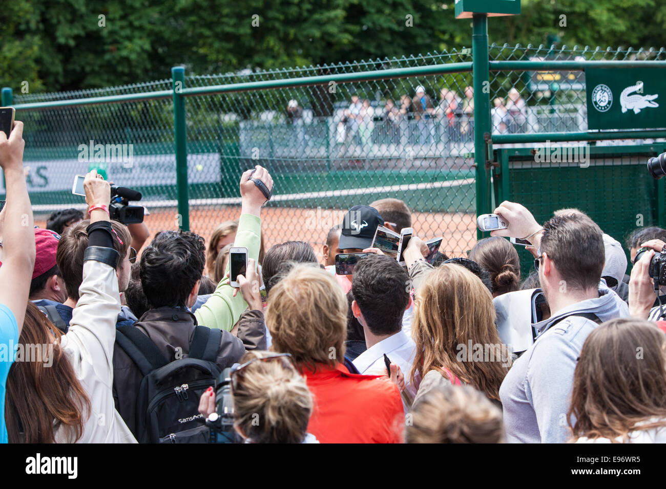 technology,mobile,phone,addiction,Rafa Nadal,cap, surrounded by fans after he practiced on outside court,Roland Garros,French Open tennis tournament,P Stock Photo
