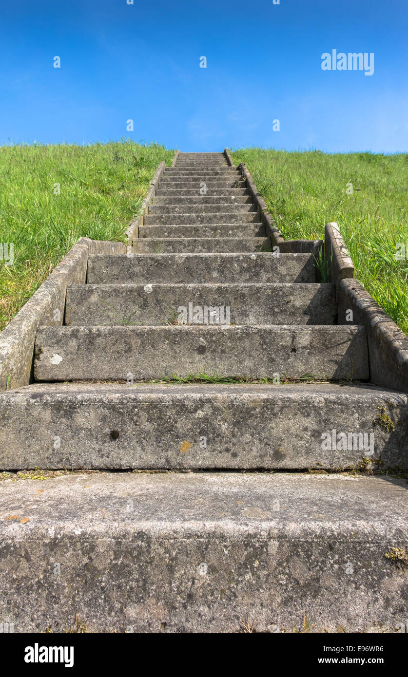 Old concrete steps leading to the top of a hill. Stock Photo
