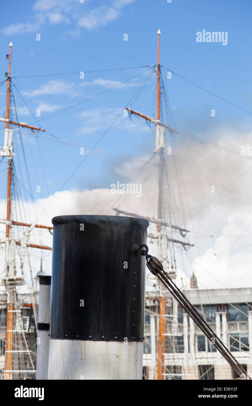 Smoke rises from the funnel of the 'Mayflower', the world's oldest steam tug (built in 1861). Stock Photo