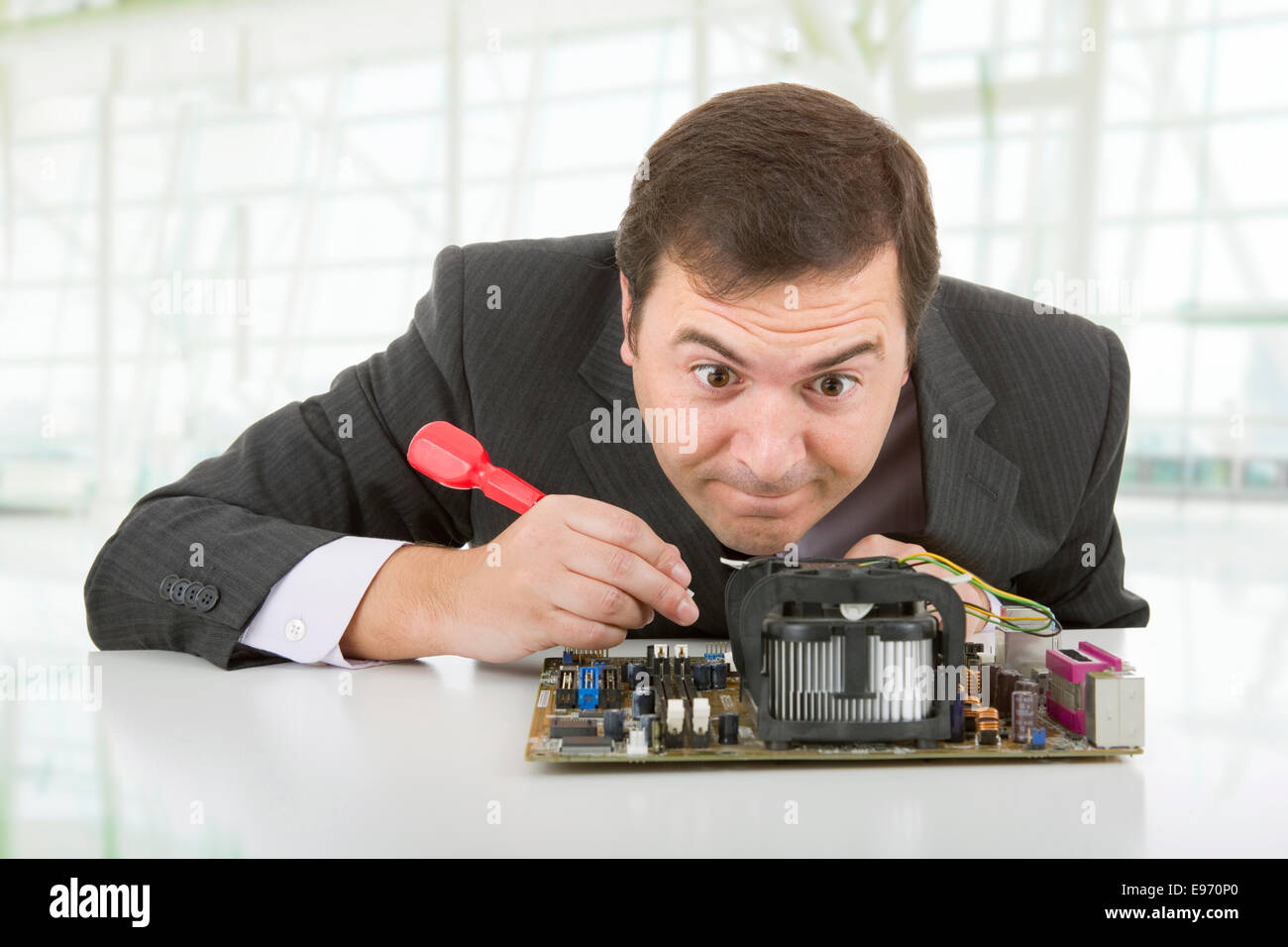 Computer Engineer working in a motherboard at the office Stock Photo ...