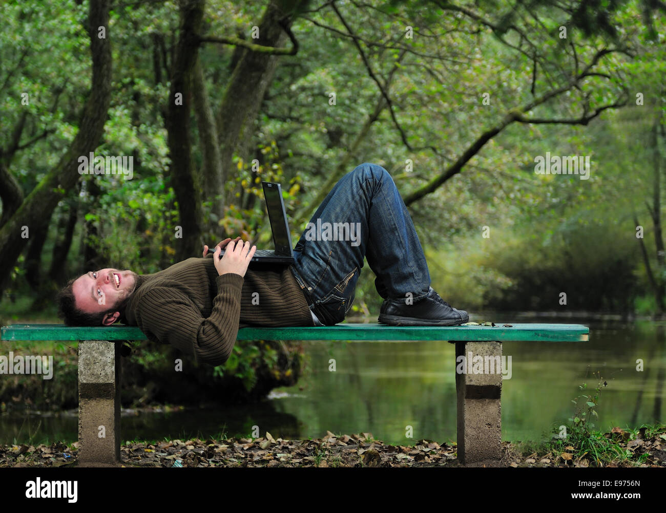 young businessman working on laptop outdoor Stock Photo - Alamy