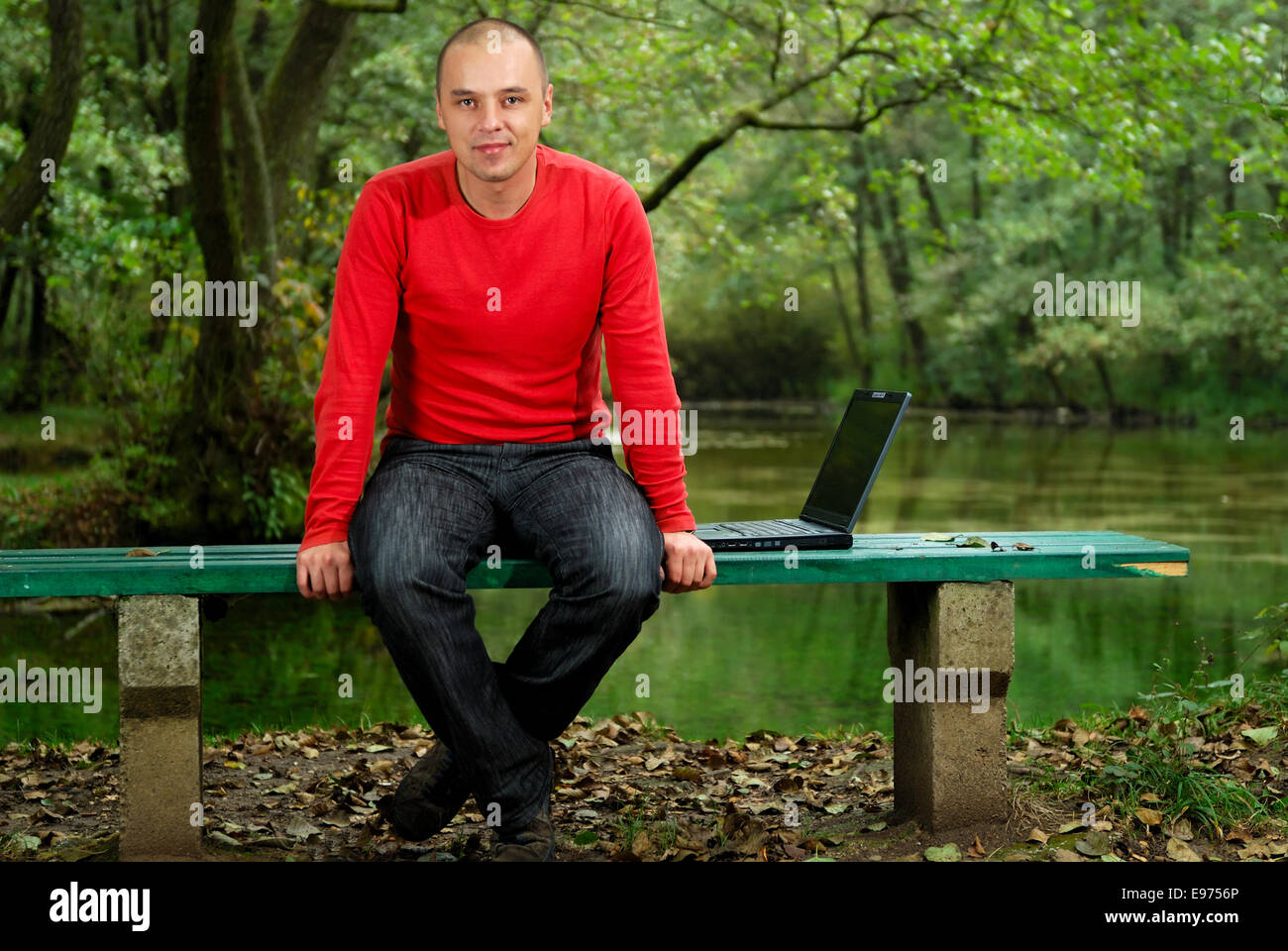 young businessman working on laptop outdoor Stock Photo - Alamy