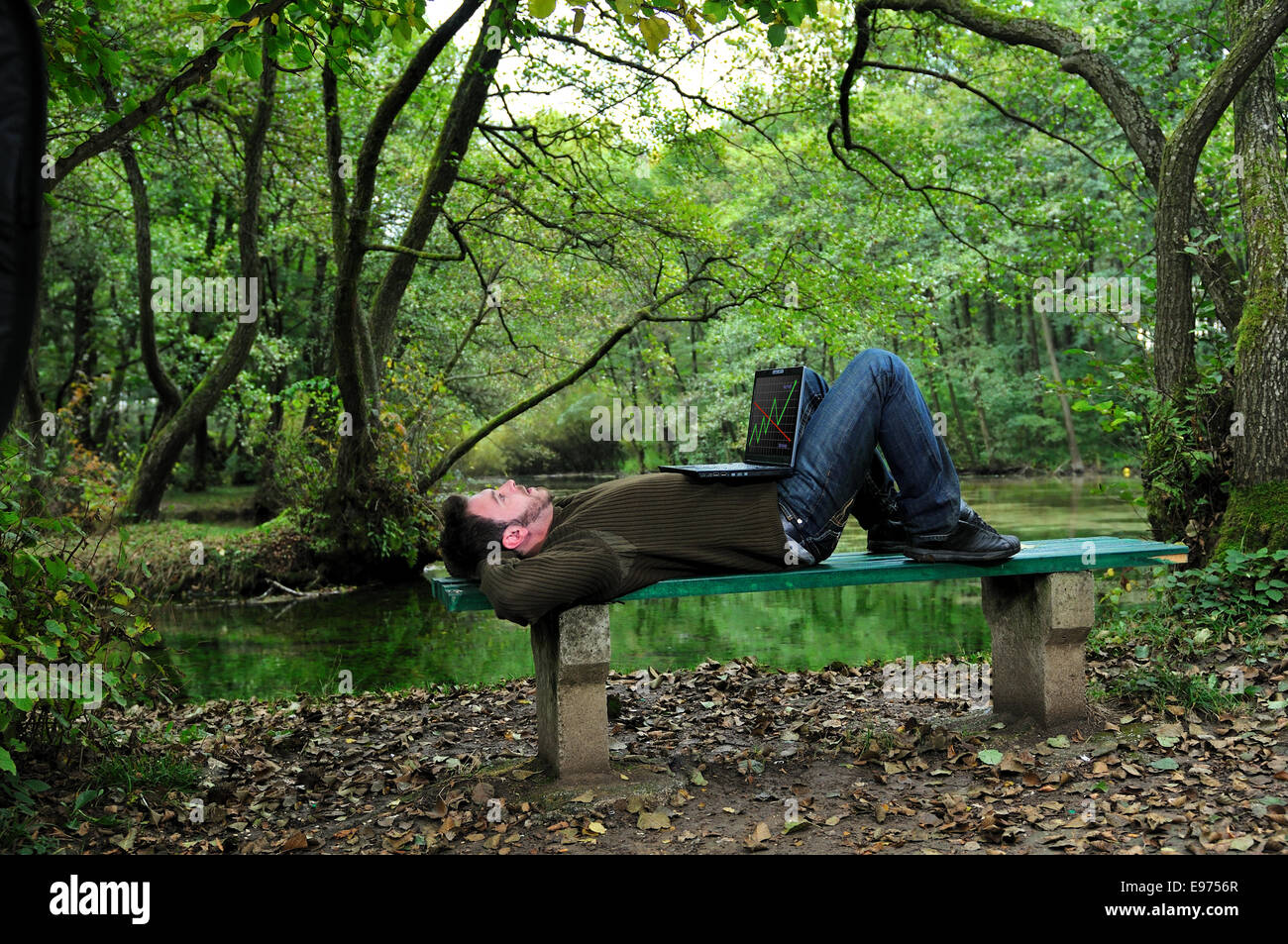 young businessman working on laptop outdoor Stock Photo - Alamy