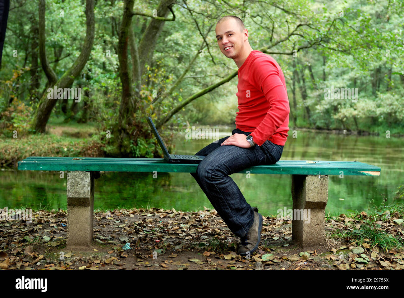 young businessman working on laptop outdoor Stock Photo - Alamy