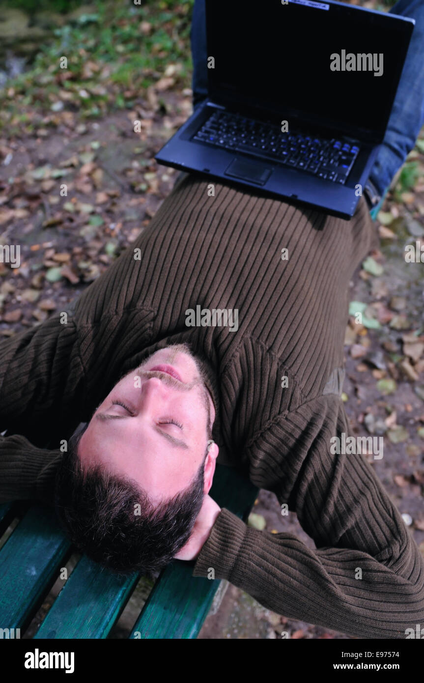 young businessman working on laptop outdoor Stock Photo - Alamy