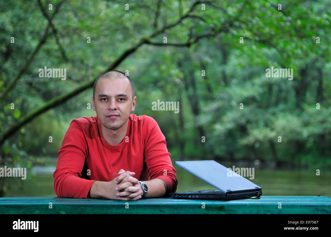 young businessman outdoor working on laptop Stock Photo - Alamy