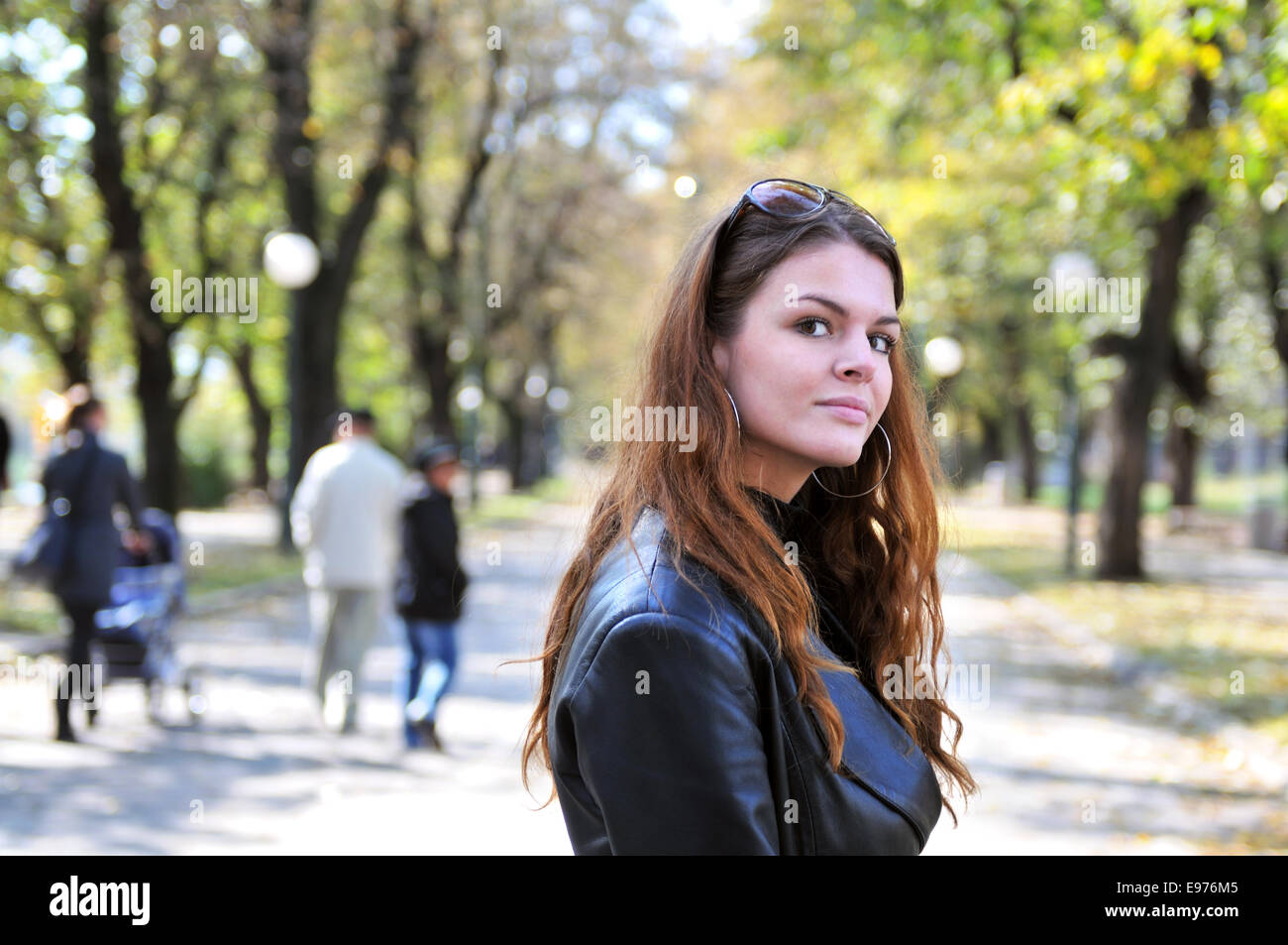 brunette Cute young woman posing outdoors Stock Photo - Alamy
