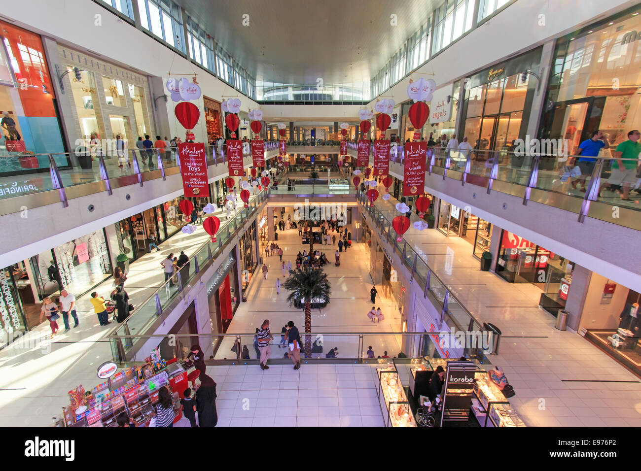 DUBAI, UAE - October 07, 2014: Shoppers at Dubai Mall in Dubai, United Arab Emirates. Dubai Mall is one of the largest mall in t Stock Photo