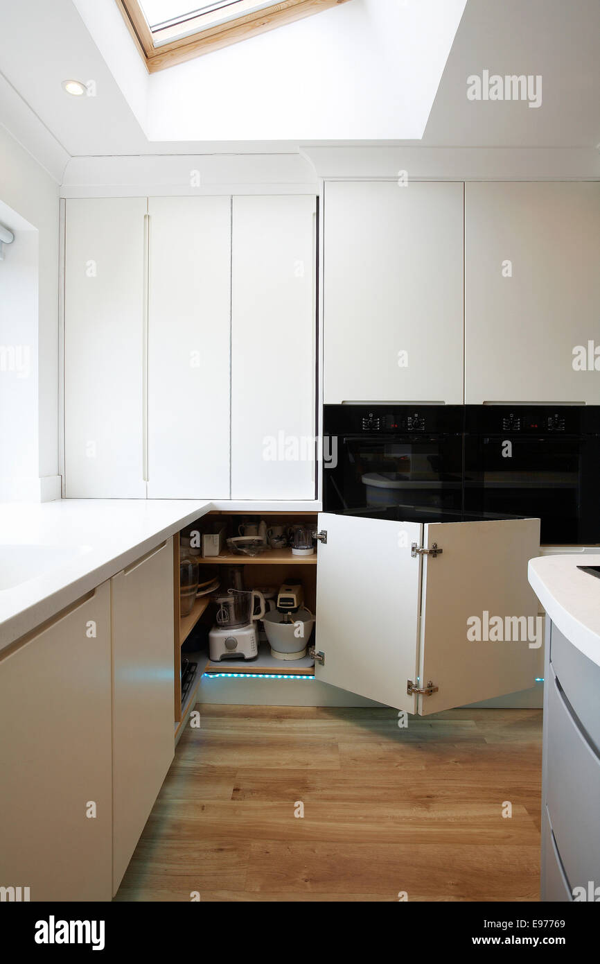 A Modern White Kitchen Inside A Home In The Uk With Folding