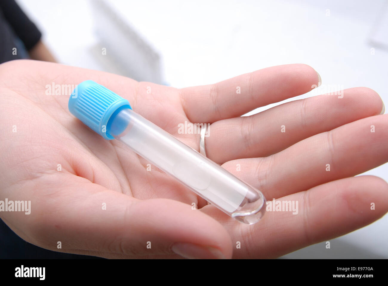 test-tube in woman hand Stock Photo