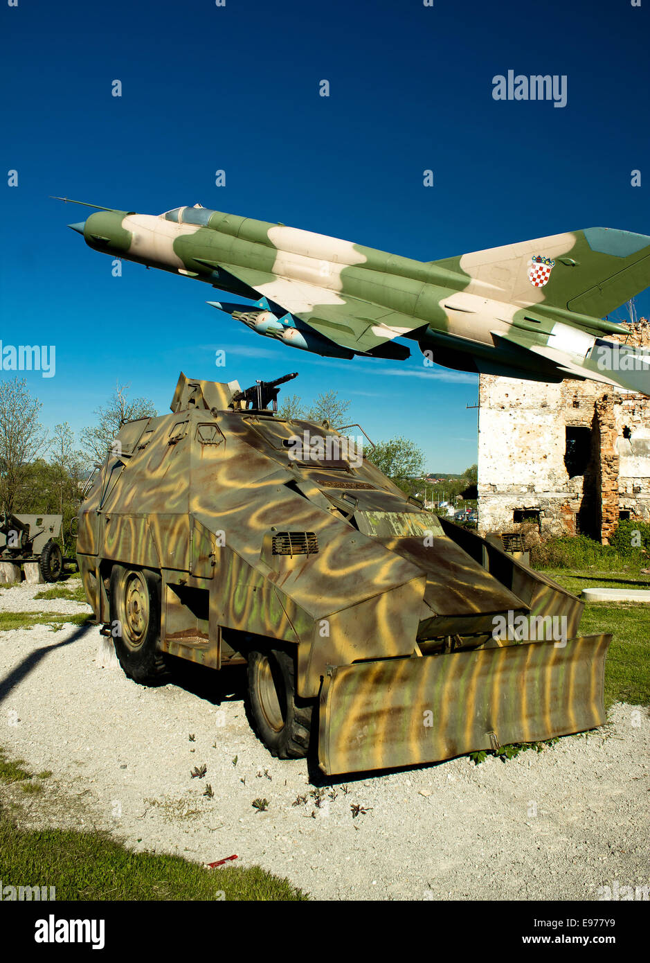 Military vehicle and MIG 21 airplane Stock Photo