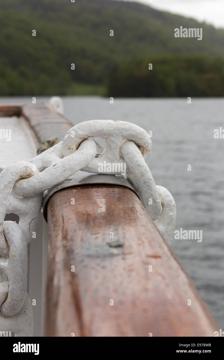 Heavy duty anchor chain draped over the bow gunwale of the Windermere Steamer MV Swan on Lake Windermere. Stock Photo