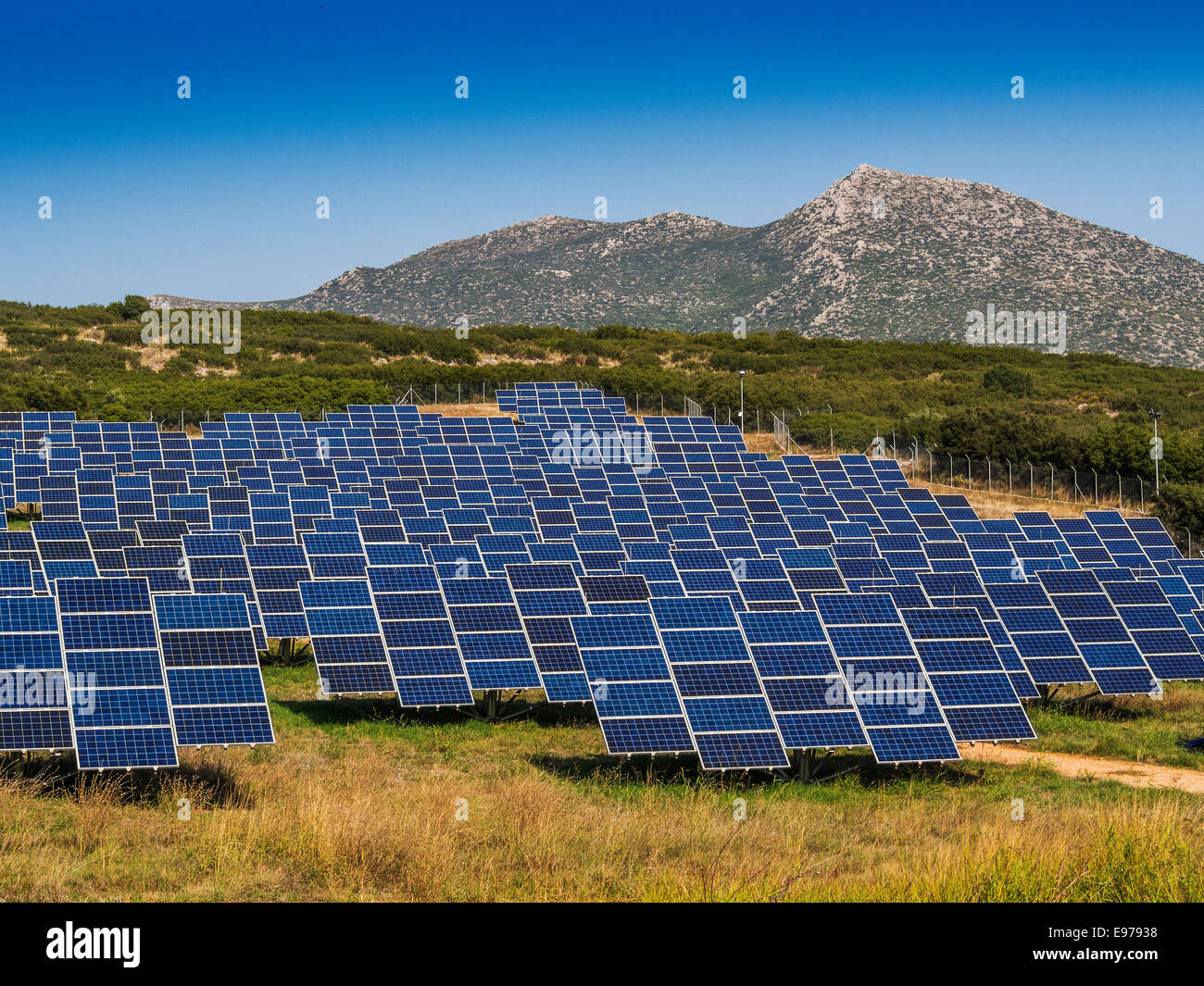 Solar panels in empty field for better sun orientation Stock Photo