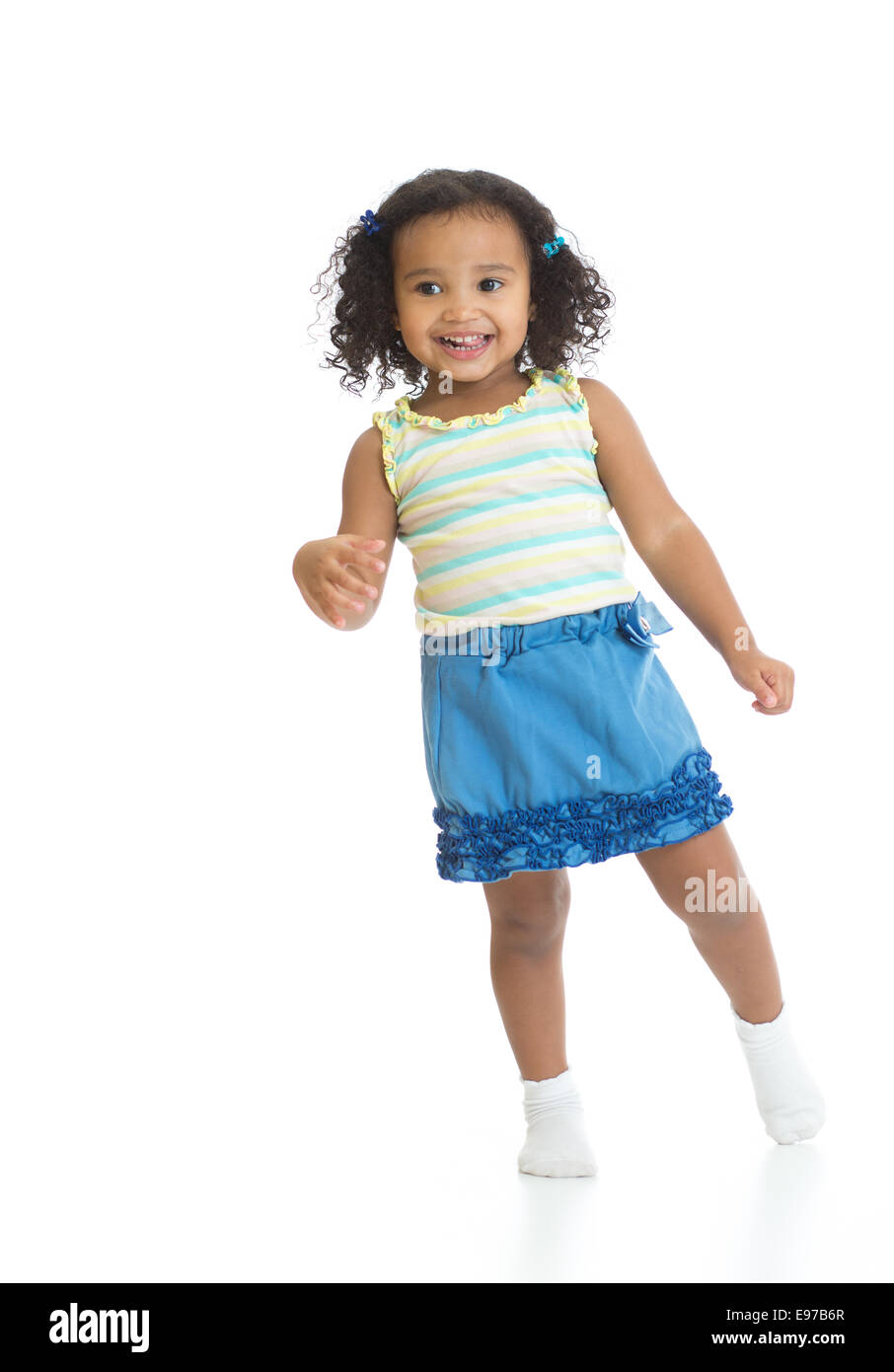 Kid girl standing or dancing full length isolated Stock Photo