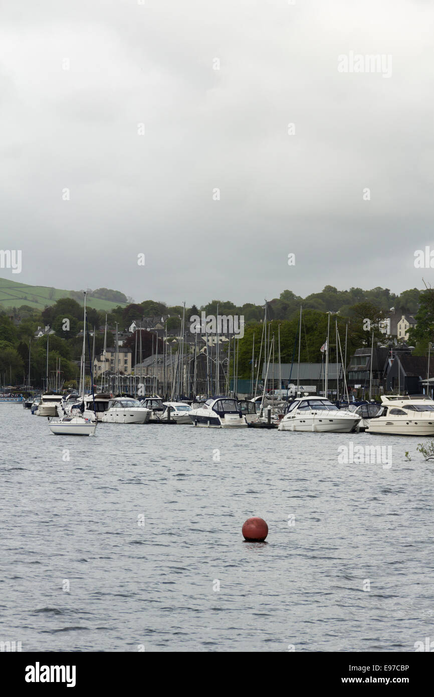 Luxury yachts and motor boats moored at Bowness Bay marina, Bowness-on-Windermere on Lake Windermere in the English Lake District. Stock Photo