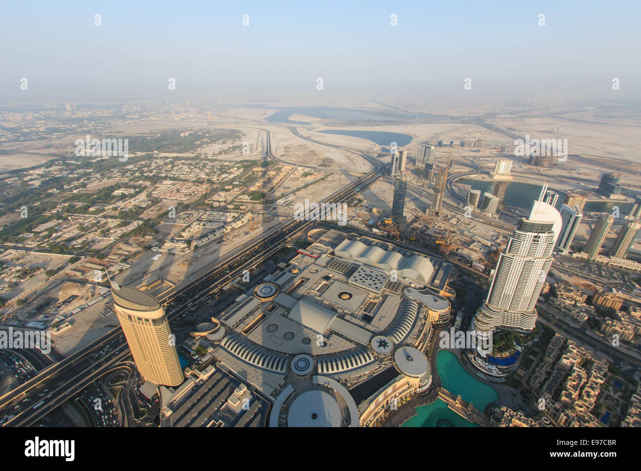DUBAI, UAE - October 07, 2014: View of Dubai at sunset from the new worlds tallest building, the Burj Khalifa. Stock Photo
