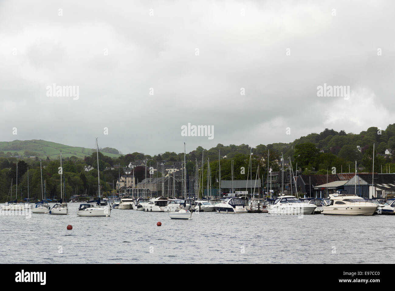 Luxury yachts and motor boats moored at Bowness Bay marina, Bowness-on-Windermere on Lake Windermere in the English Lake District. Stock Photo