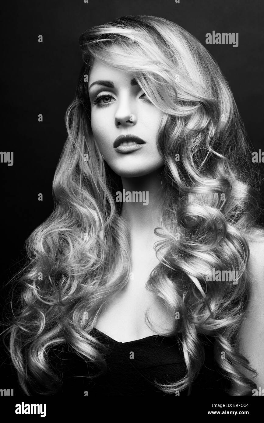 Portrait of a beautiful woman with long curly hairs Portrait of a beautiful woman with long curly hairs