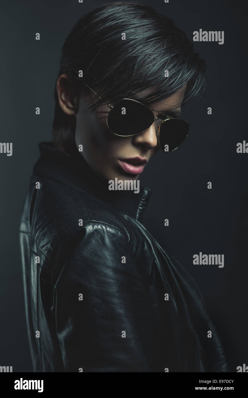 Portrait of a sad woman on black background Stock Photo - Alamy