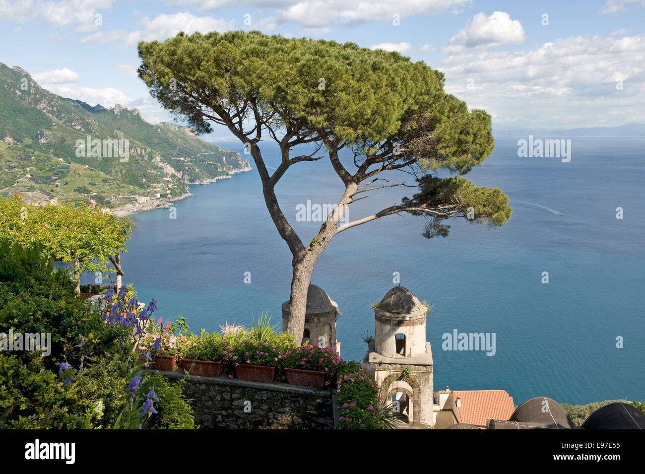 View of the Amalfi Coast and chapel from the gardens of the Villa Rufolo in Ravello with an Italian stone pine Stock Photo