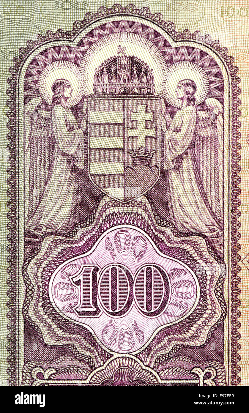 Detail from a 1930 Hungarian 100 Pengo banknote showing two angles holding the Hungarian coat of arms Stock Photo