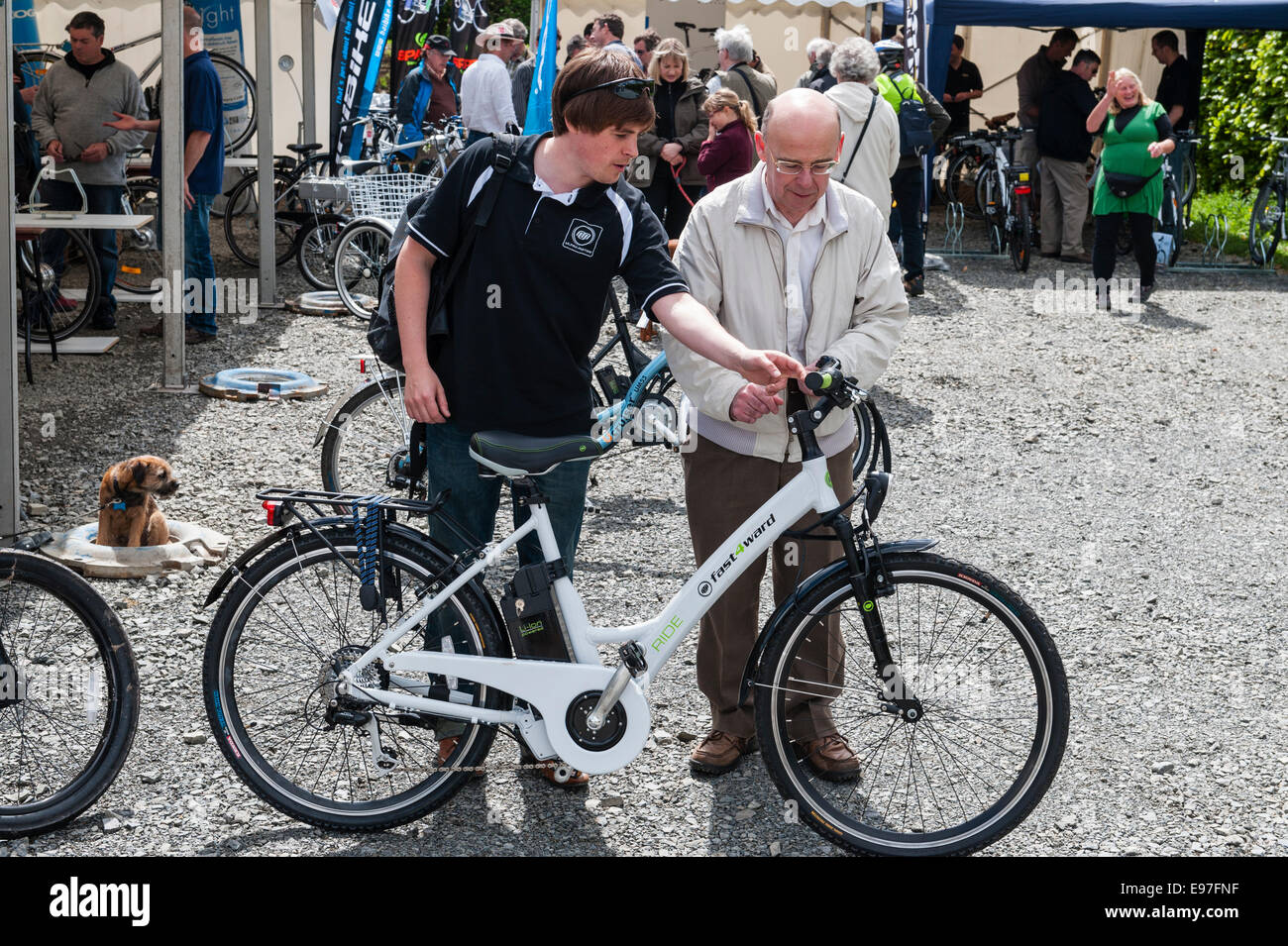 Presteigne, Powys, UK. Interested visitors at a demonstration of electric bikes Stock Photo