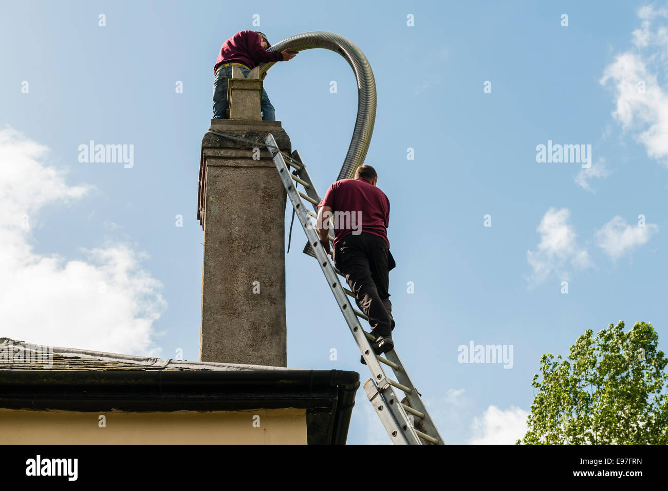 Inserting a flexible chimney liner into the chimney of an old house, UK