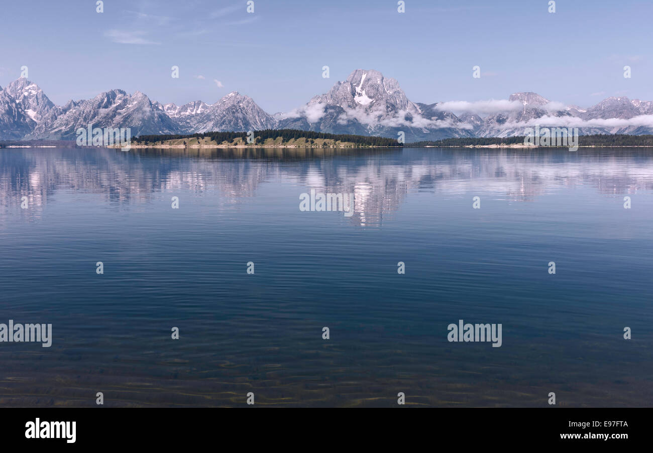 Jenny Lake with the Grand Tetons in the background on a fine morning in summer near Jackson, Wyoming, USA. Stock Photo