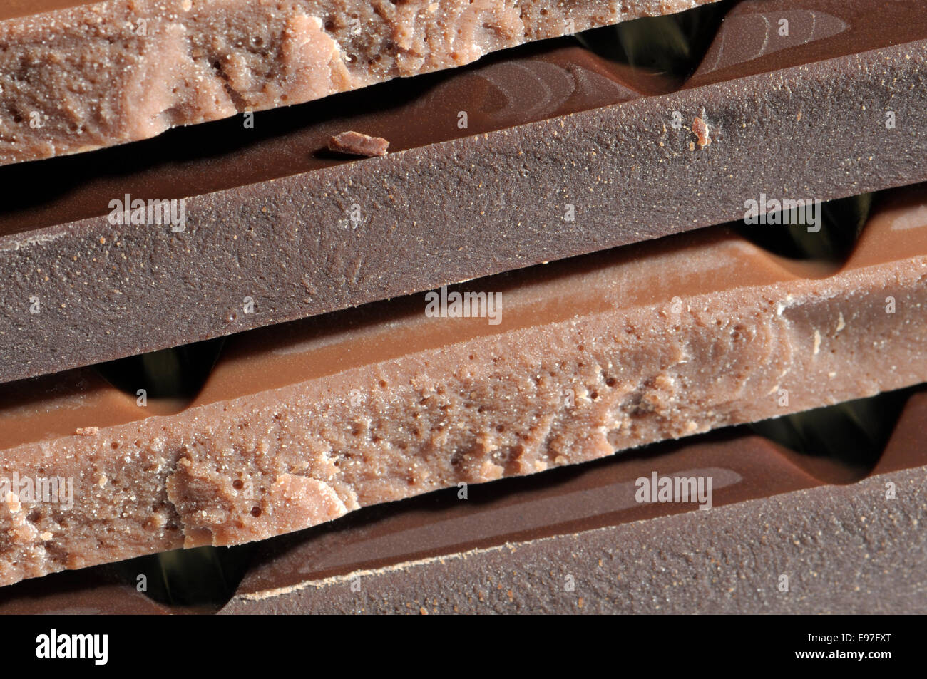 Layers of milk and dark chocolate bars Stock Photo