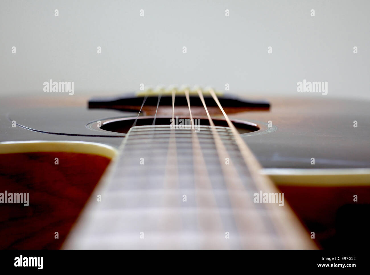 Guitar positioned horizontal to have space at top of image to design on it Stock Photo