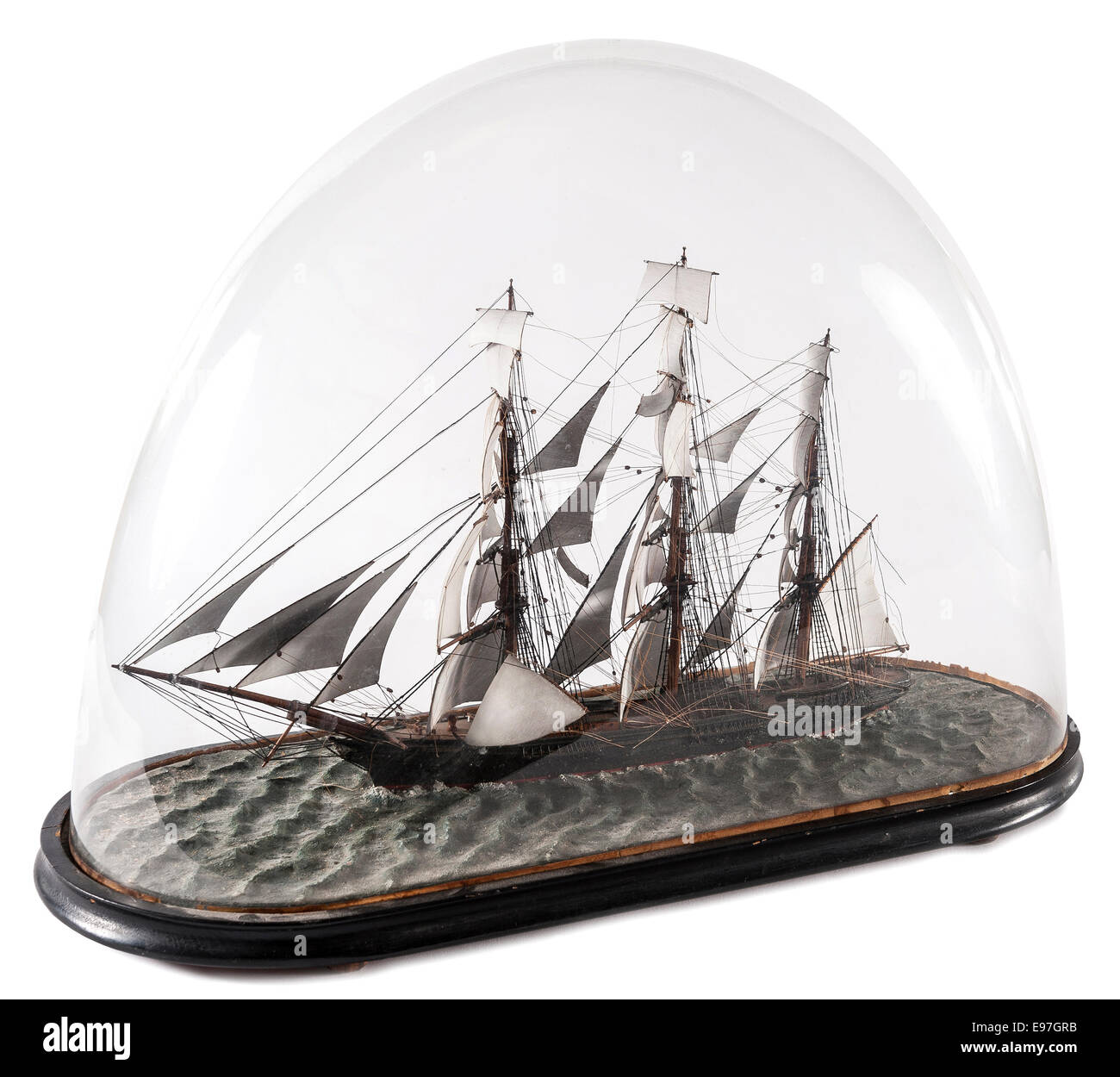 Model of a three masted sailing ship in glass domed case Stock Photo