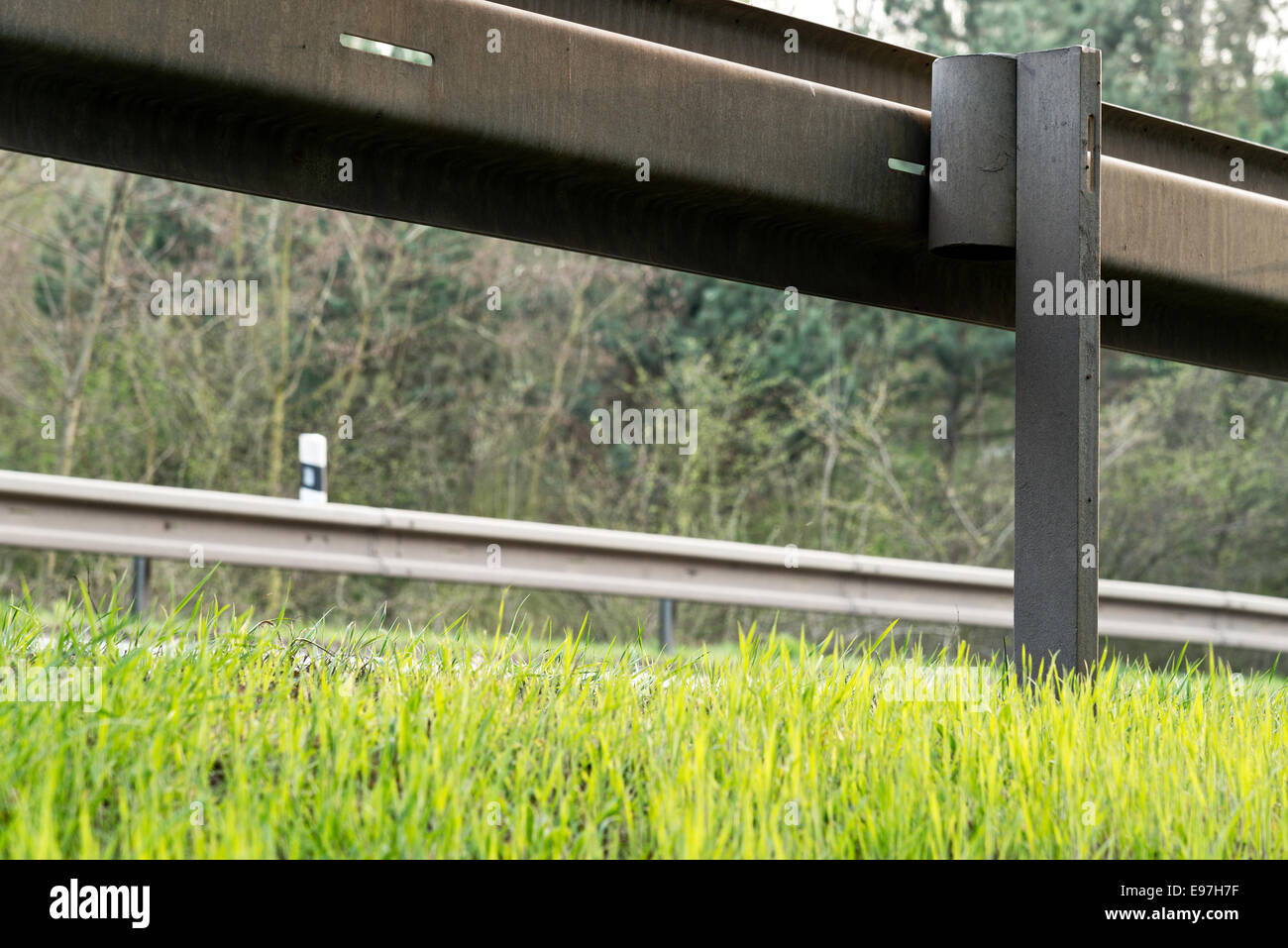 a crash barrier with roadside in the springtime Stock Photo - Alamy