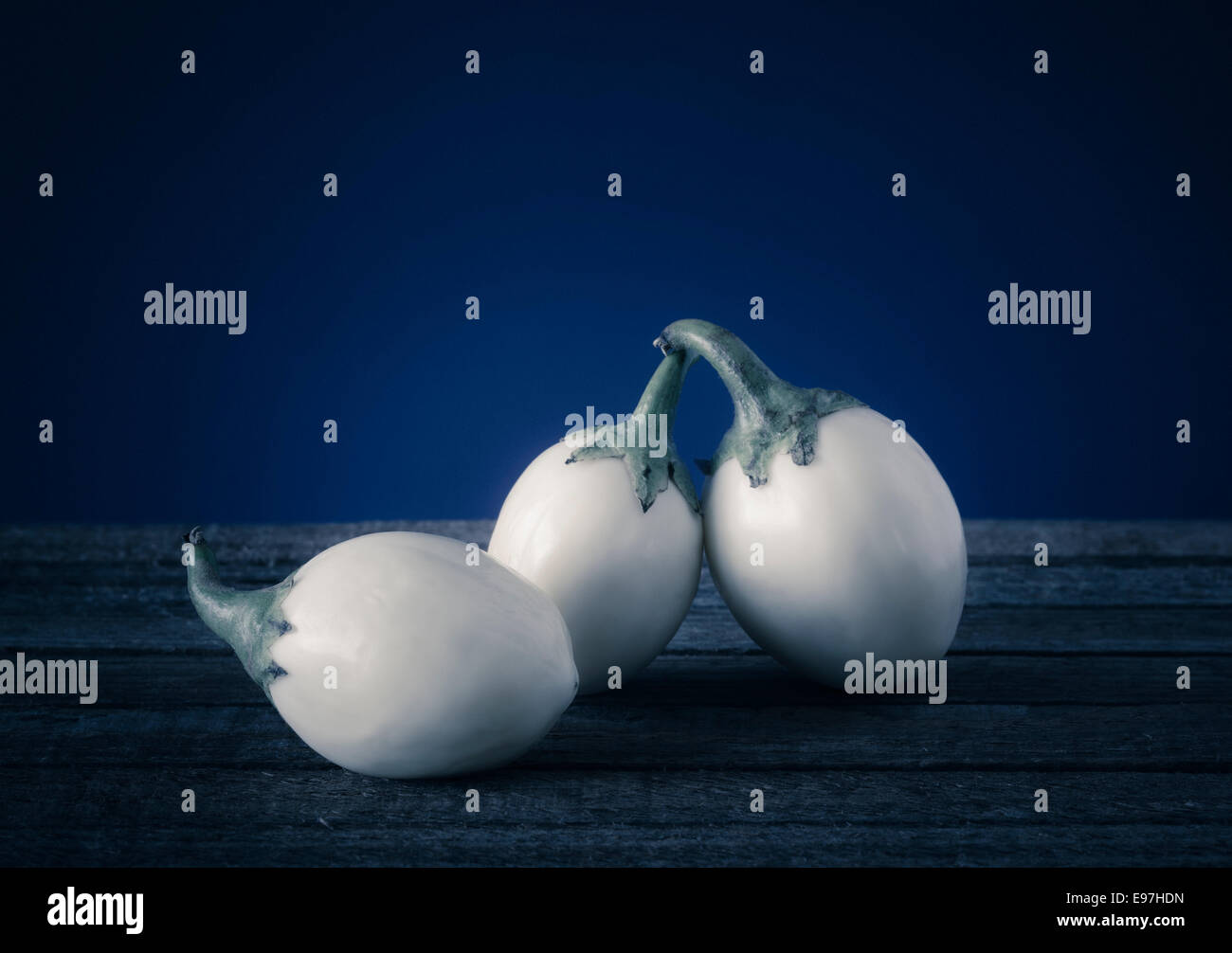 Three white Aubergines, mini Eggplants Stock Photo
