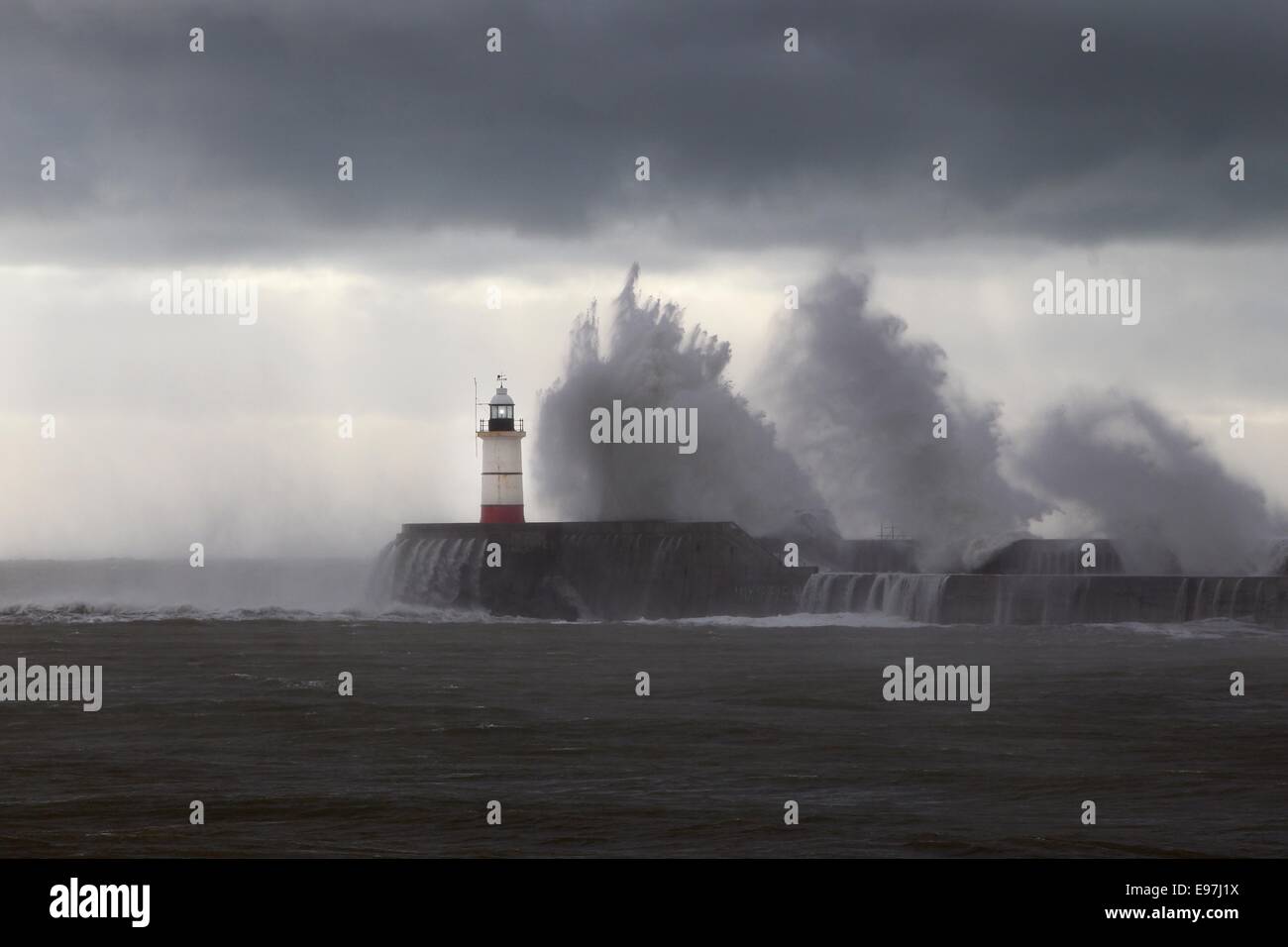 Waves crash onto the harbour wall at Newhaven as the tail end of Hurricane Gonzalo reaches the British Isles. Stock Photo