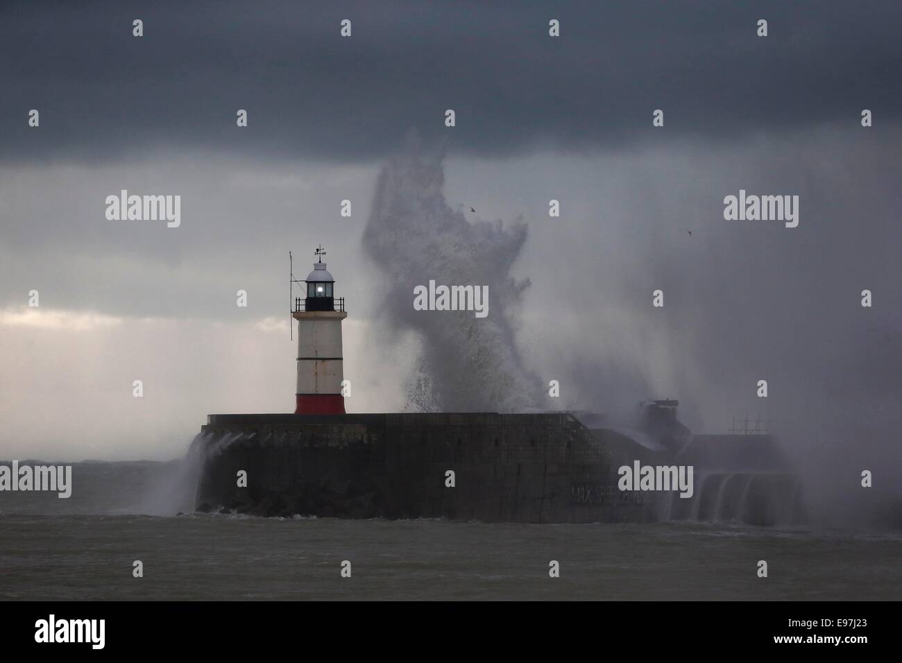 Waves crash onto the harbour wall at Newhaven as the tail end of Hurricane Gonzalo reaches the British Isles. Stock Photo