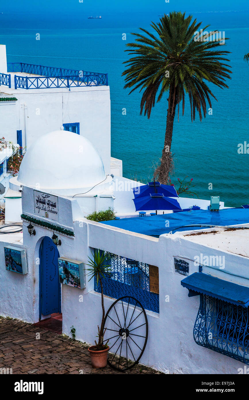 View over the famous Cafe Sidi Chebaane with the Gulf of Tunis beyond, in Sidi Bou Said, Tunisia. Stock Photo