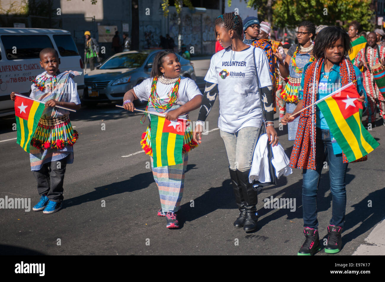 Participants carry flags from many African nations marching in the