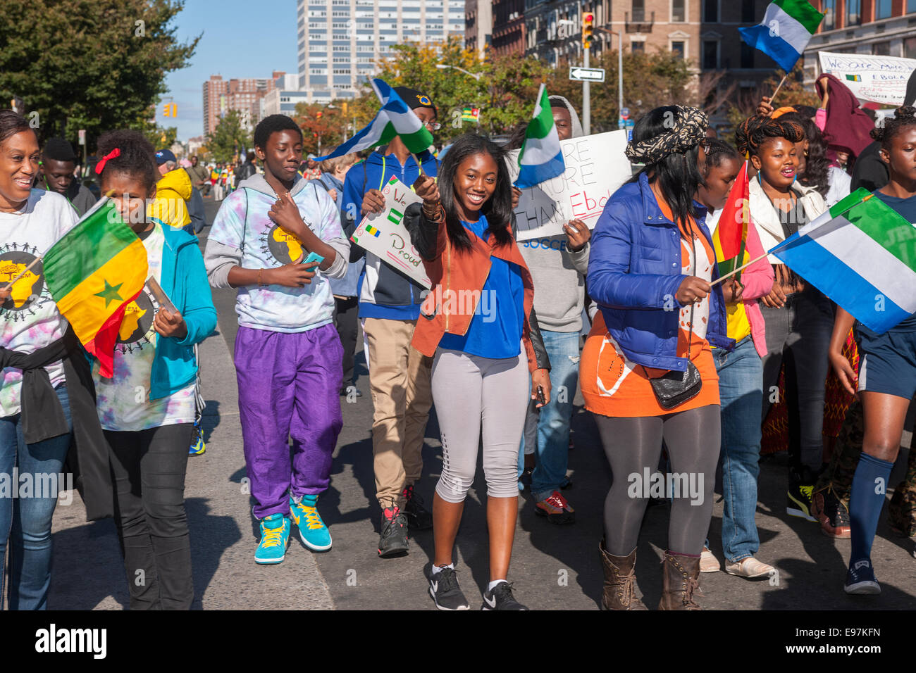 Participants carry flags from many African nations marching in the