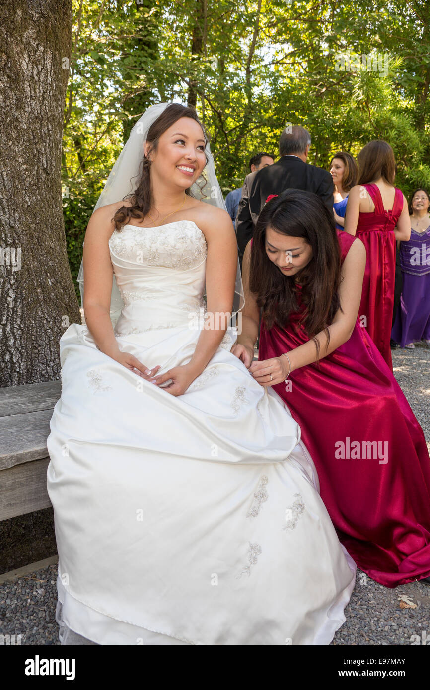 bride and bridesmaid wedding at the Marin Art and Garden Center in the city of Ross in Marin County California Stock Photo