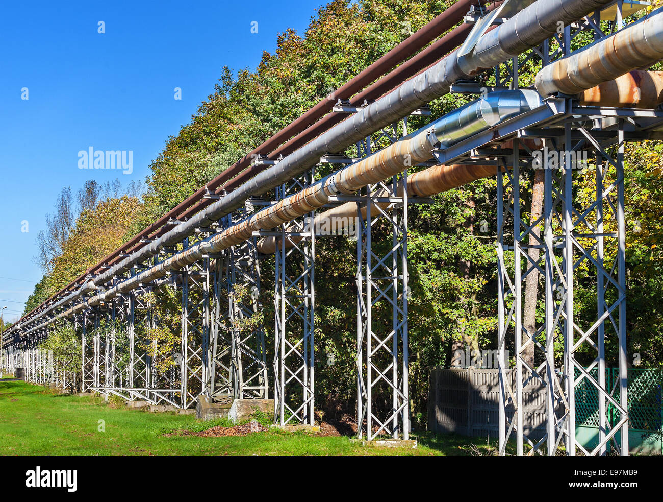 Industrial pipelines construction in green area. Stock Photo