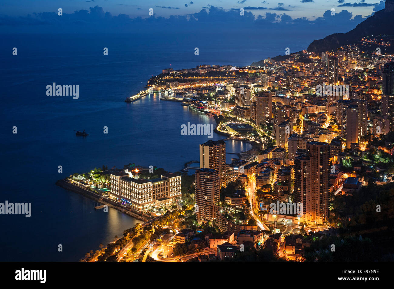 Aerial view over the city and port of Monte Carlo, Monaco along the French Riviera at night, Côte d'Azur Stock Photo