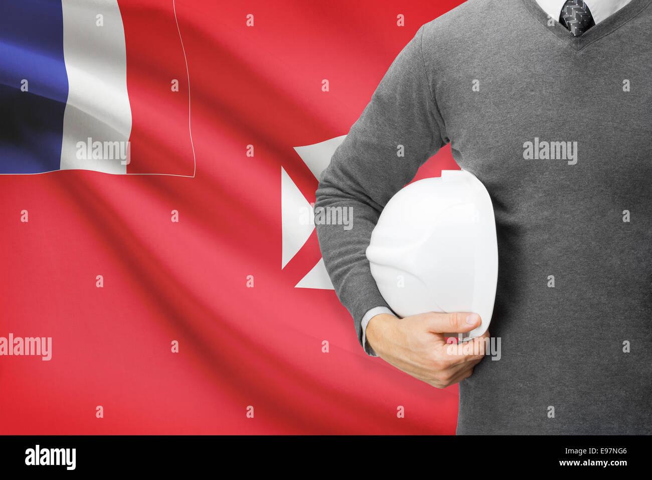 Engineer with flag on background - Territory of the Wallis and Futuna Islands Stock Photo