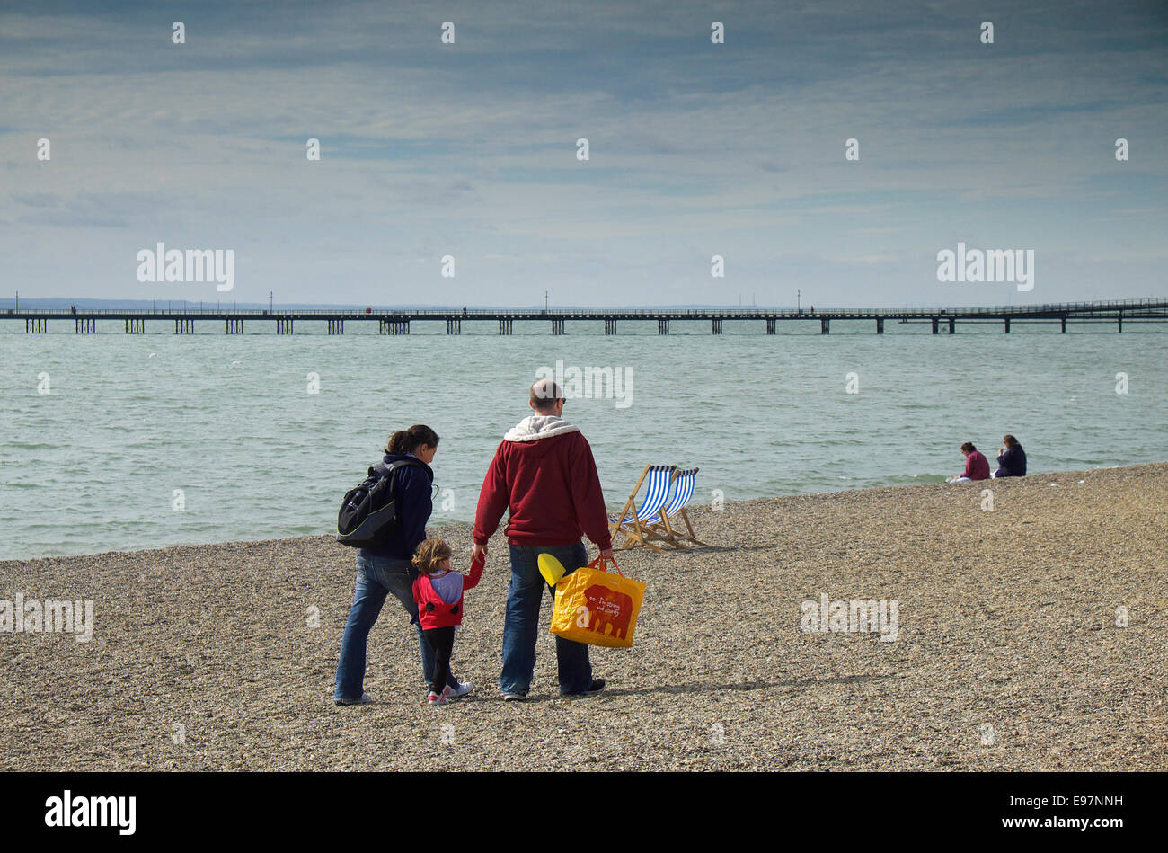 A family walking along Jubilee Beach in Southend in Essex. Stock Photo