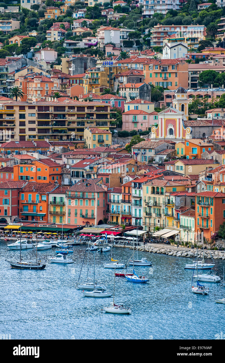 Sailing boats and colourful houses in the city Nice along the French Riviera, Côte d'Azur, Alpes-Maritimes, France Stock Photo